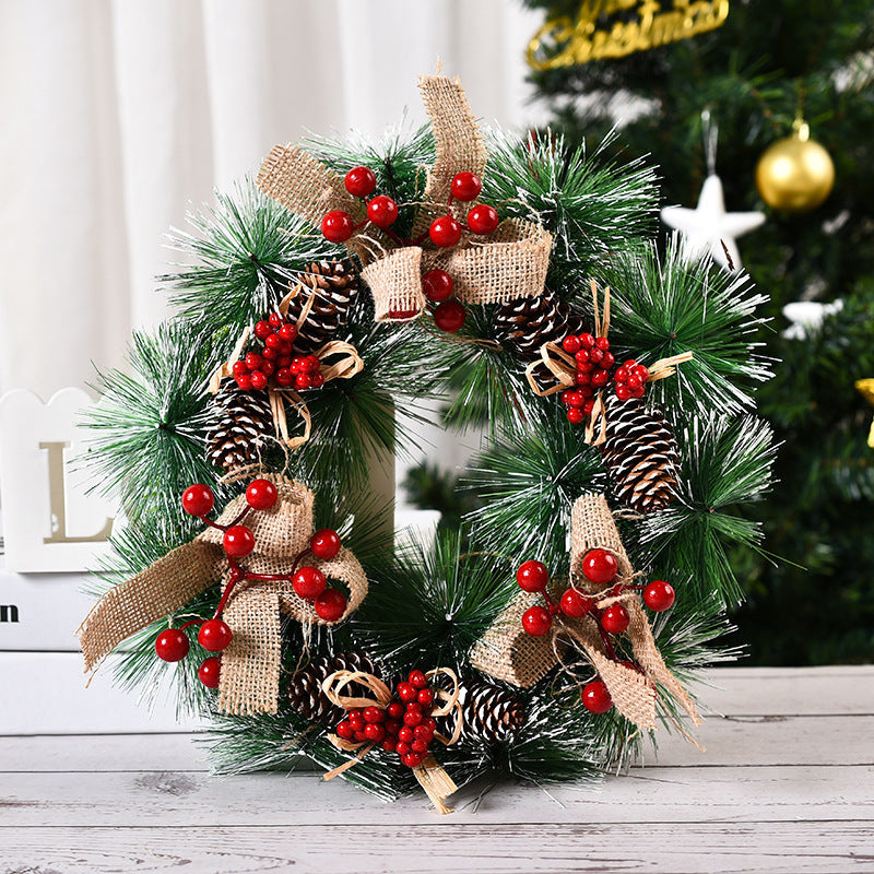 Faux Christmas wreath with snow and berries close up